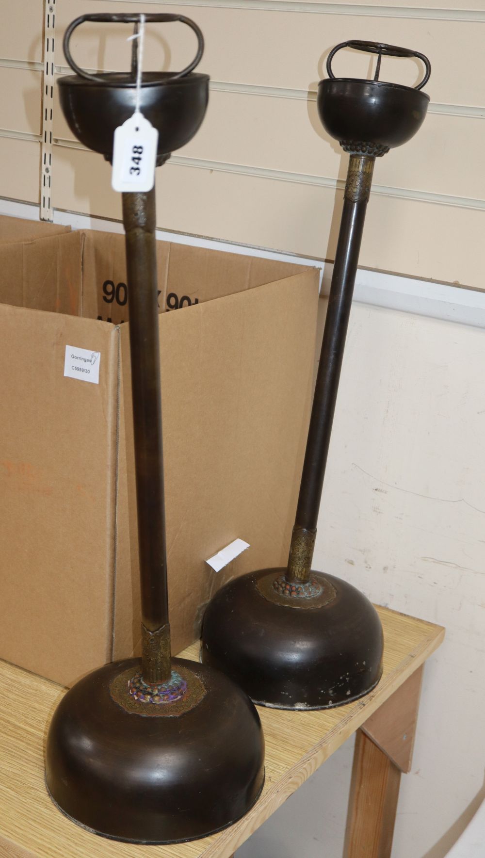A pair of 19th century and later Chinese bronze altar sticks, height 69cm